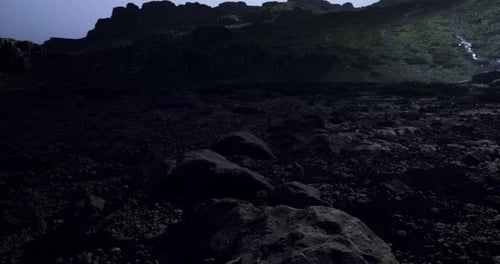 Exploring Rocky Terrain Under a Twilight Sky in a Remote Mountain Area