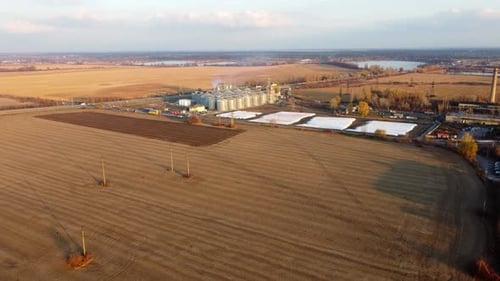 Panoramic View of Yellow Dry Wheat Field After Harvest Grain Elevator