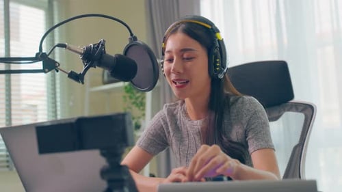 Woman Recording Podcast in Home Studio