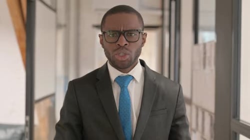 Portrait of Unsatisfied African Businessman Fighting in Argument