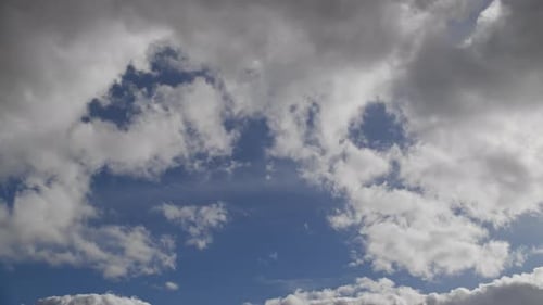 Clouds Drifting Across a Blue Sky