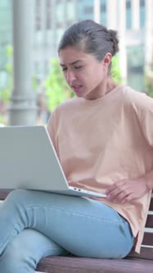 Indian Woman having Back Pain while using Laptop in Office, Vertical Video