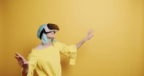 Woman Using VR Headset in Studio