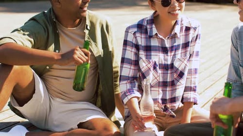 Friends Gather and Chat on Sunny Day Outdoors