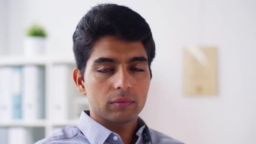 Smiling Young Man in Office Close Up Portrait