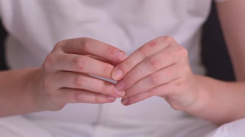 Tensed Hands Of Nervous Woman With Anxiety And Stress Disorder. closeup shot