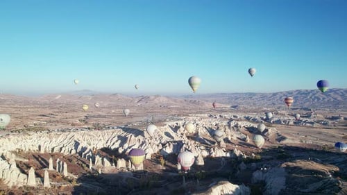 Hot Air Balloons Fly Over Cappadocia Landscape