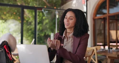 Happy woman, wave and video call with laptop in cafe for online meeting, communication or chat