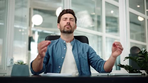 Handsome Relaxed Young Handsome Businessman Reducing Stress Meditating