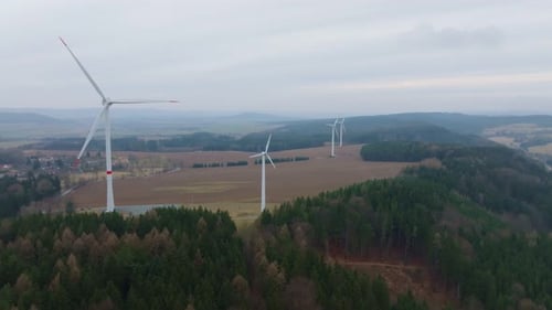 Wind Turbines Spinning in a Countryside Landscape