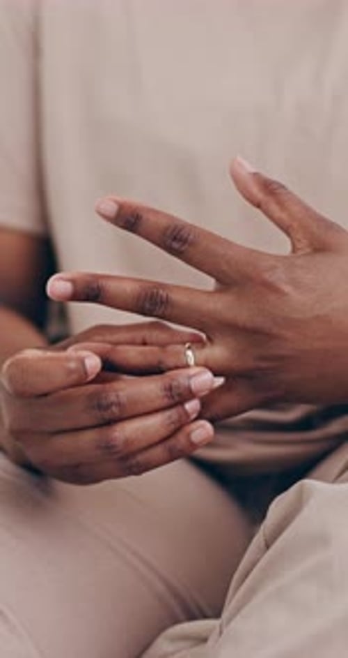 Person, hands and ring in divorce, cheating affair or toxic relationship in jewelry removal at home