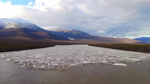 Majestic Lake Encircled by Towering Mountains