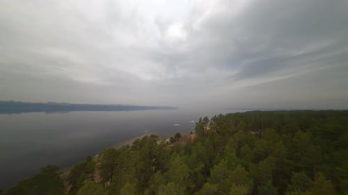 Panoramic view of river landscape Large and wide river near forest and city. Top view. Spring.