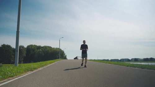 Man Running on a Path in Daytime