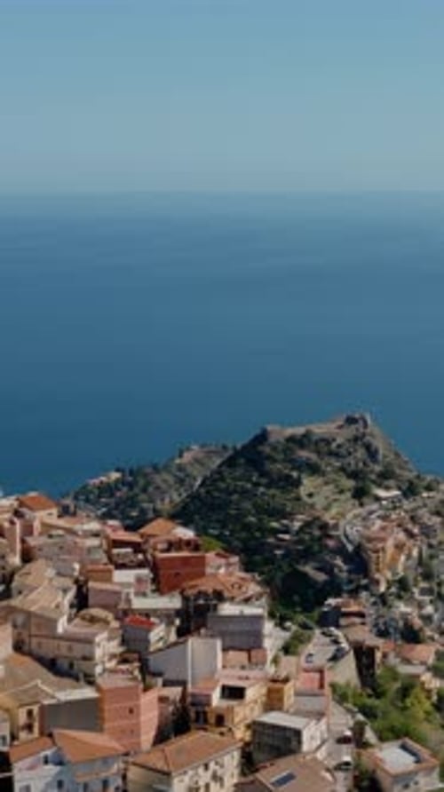 Vertical aerial view of Charming Historic village in Sicily. Ancient town up in the mountains on the