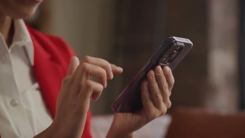 Close Up of Businesswoman Hands Using Smartphone