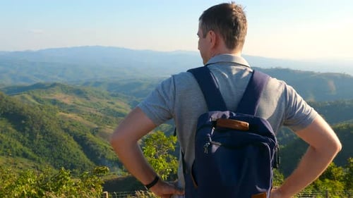 Man with Backpack Views Mountainous Vista