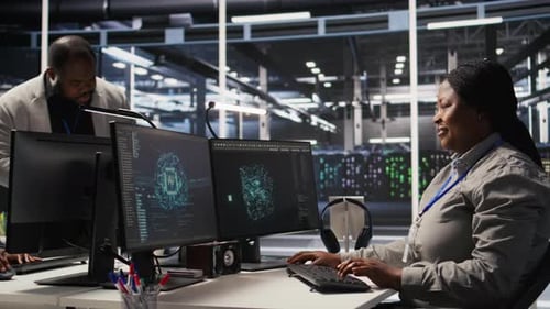 Data Center Programmer Coding on PC Doing Software Updates for AI Systems