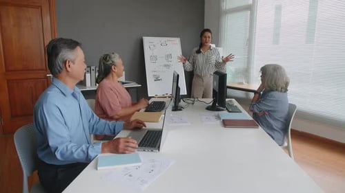 Adults Meeting and Discussing in Modern Office