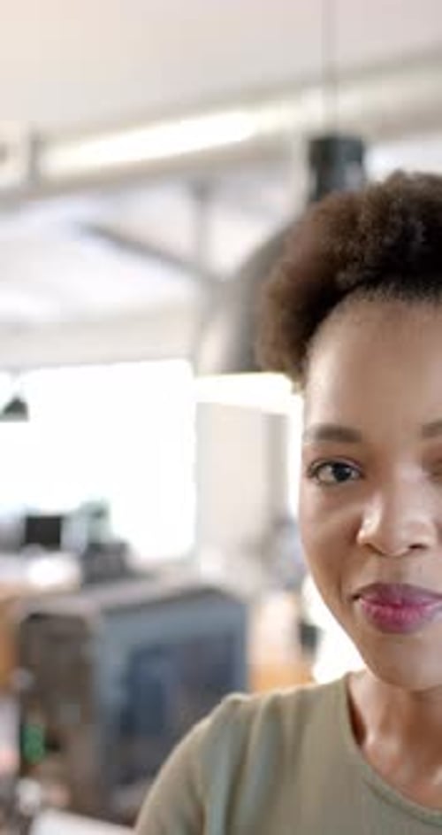 Close Up of Smiling Woman in Workplace Setting