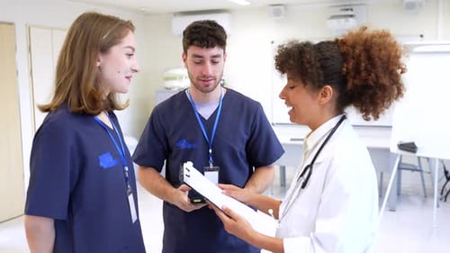 Medical Team Discussing Patient Information in Hospital Room