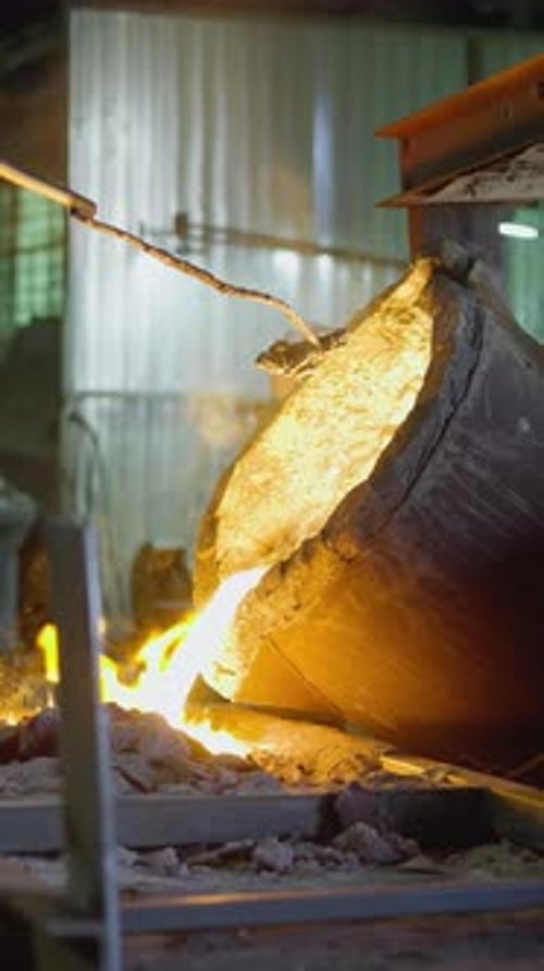Molten Metal Pouring in Foundry Workshop