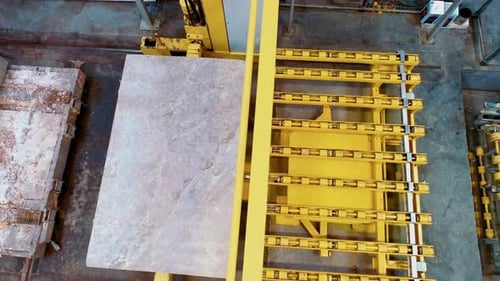 Alineación automatizada de losas de mármol