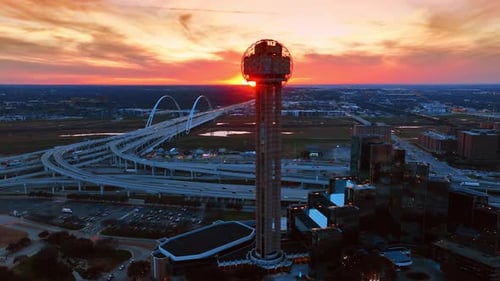 Reunion Tower switching on lights at sunset.