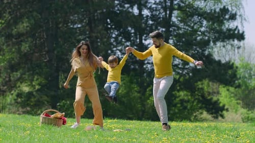 Happy Family Playing in Spring Park
