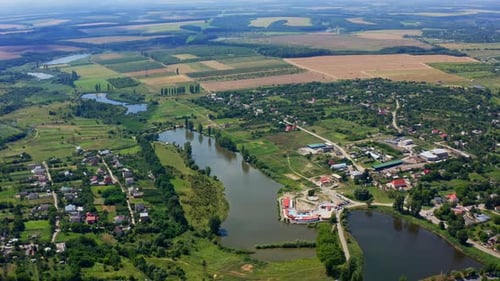 Panoramic landscape in summer. Nature scenery in the countryside. Agricultural fields, lakes