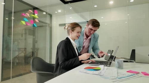 Laptop, collaboration and a manager with a business woman in the office for training or introduction