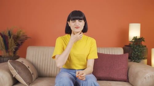 Woman with sore throat.