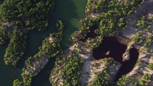 Colorful lakes with polluted toxic water in abandoned open pit mine. Aerial view from drone.