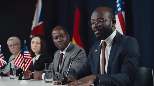 Worried Black Male Politician Speaking at International Summit