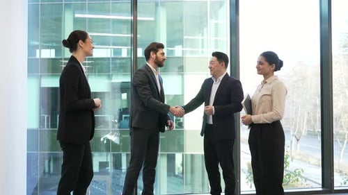 Business meeting of partners handshake standing in modern office negotiators Greeting Start up new