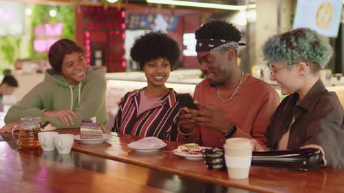 Gen Z Friends Taking Photos of Desserts with Phone at Food Court