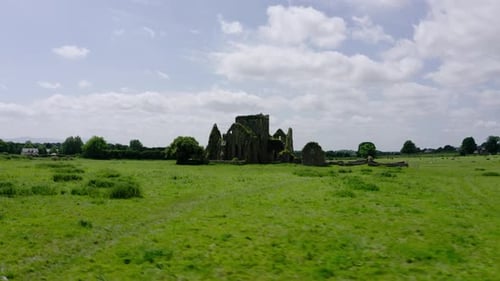 Drone shot of castle ruins in Europe's countryside.