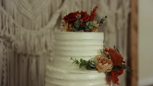 Elegant White Wedding Cake with Floral Decorations