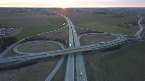 Aerial View of Freeway Intersection with Moving Traffic Cars
