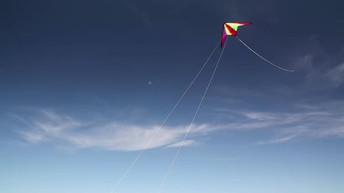 Colorful Kite Flying in a Vivid Blue Sky