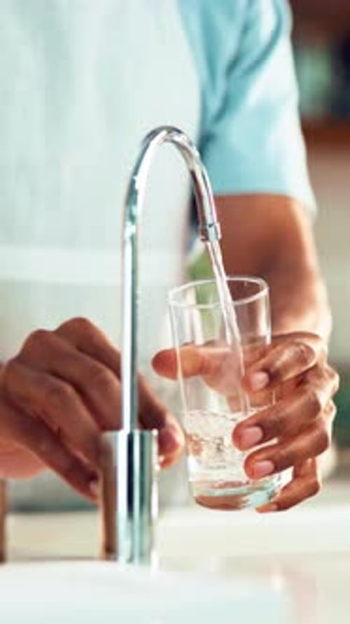 Glass Filling With Refreshing Water From Faucet