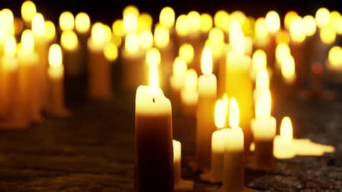 Flickering Candles in a Dark Room with Warm Bokeh Light