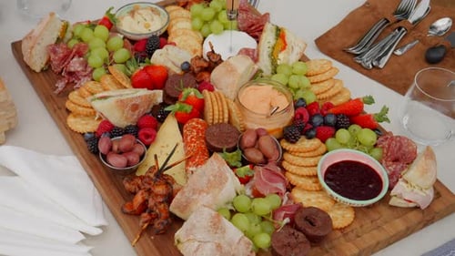 Food board platter of healthy food rotating smoothly and slowly outside during the day