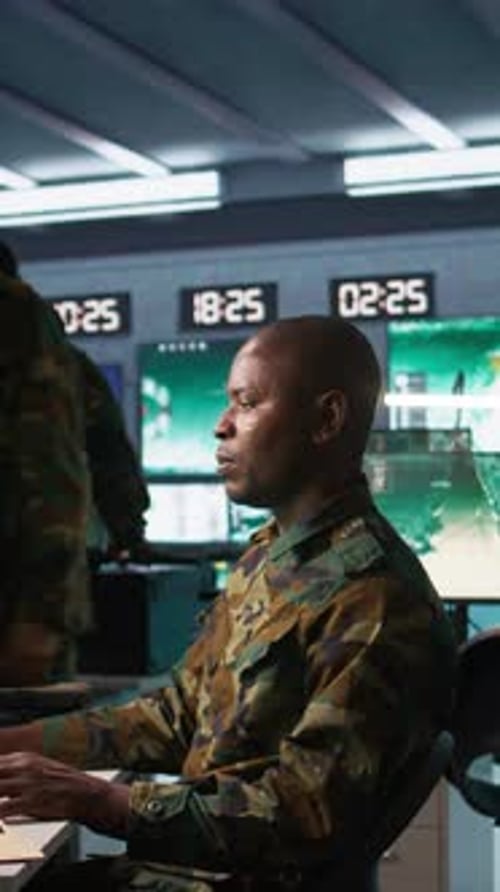 Military Personnel Work in Dark Control Room