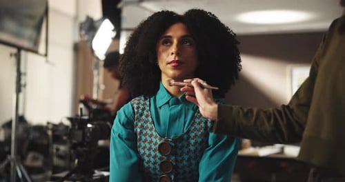 Beautiful Woman Having Her Makeup Professionally Applied