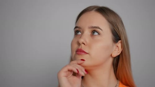 Young Woman Thinking with Hand on Chin