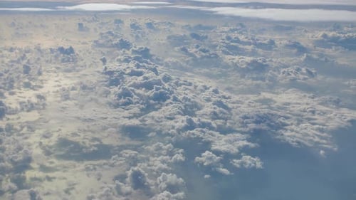 The View From the Window of the Plane on the Beautiful Clouds