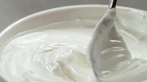 Stirring Vanilla Yogurt In