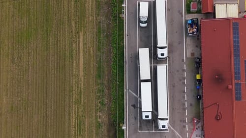Truck Stop Parking Lot With Freight Trucks Aerial Highway View