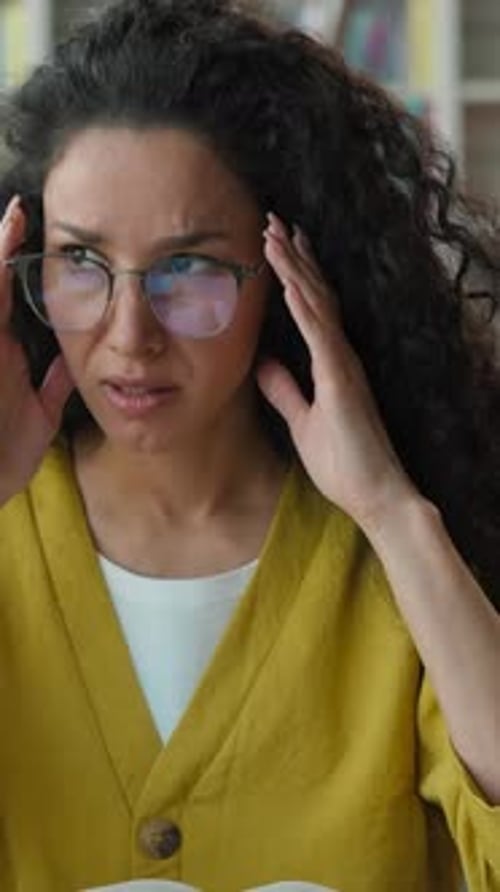 Exhausted Latino Arabian Woman Student Taking Eyeglasses Reading Book in University Library Female